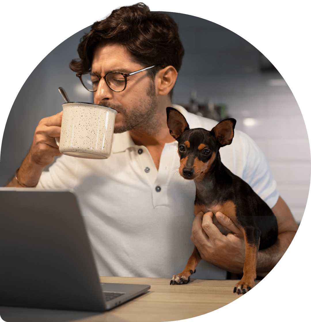 A man sitting with a cup of coffee while his dog lies relaxed next to him. This is where thoughts about marketing, the future and ideas arise.