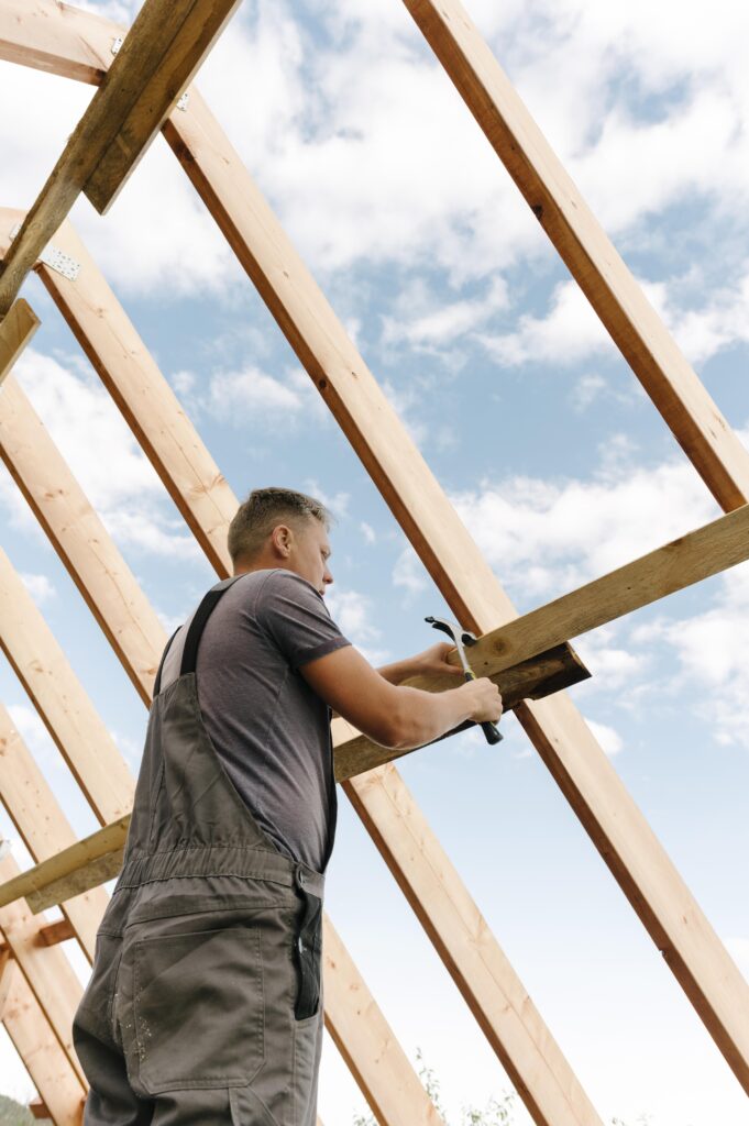 construction worker building roof house